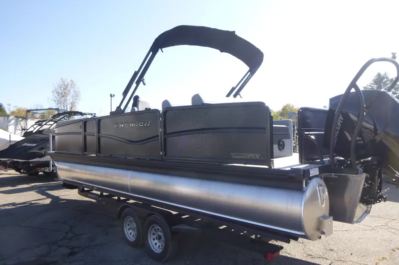 Slide: The Image of 2027 Premier 250 Sunsation RLO-CL pontoon boat on trailer, outdoor setting. - 9
