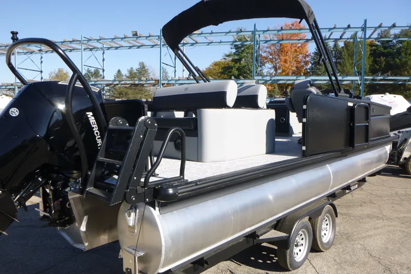 Slide: The Image of 2027 Premier 250 SUNSATION RLO - CL pontoon boat on trailer, featuring Mercury engine. - 4