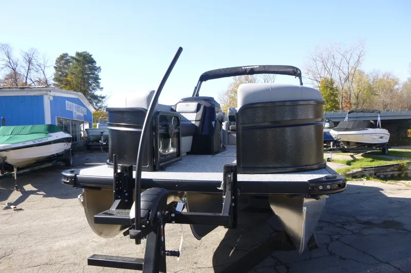 Slide: The Image of 2027 Premier 250 SUNSATION RLO - CL pontoon boat on trailer, outdoor setting. - 12