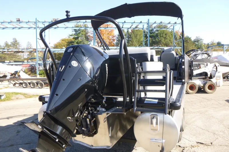 Slide: The Image of 2027 Premier 250 SUNSATION RLO - CL pontoon boat with powerful outboard motor, docked outdoors. - 5