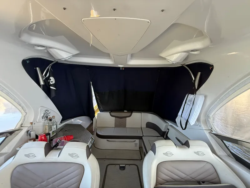 Slide: The Image of Interior of a 2018 Chaparral 337 SSX with sleek seating and a table. - 3