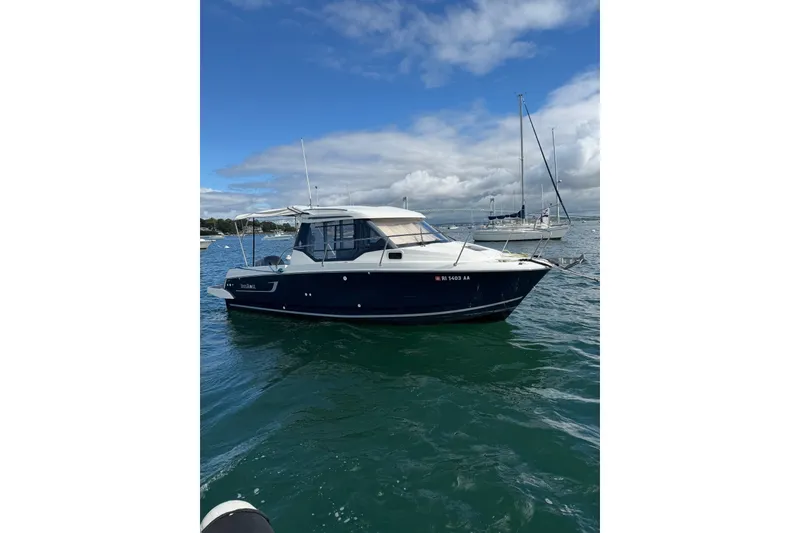 The Image of 2019 Jeanneau NC 795 boat on water under blue sky. - 13