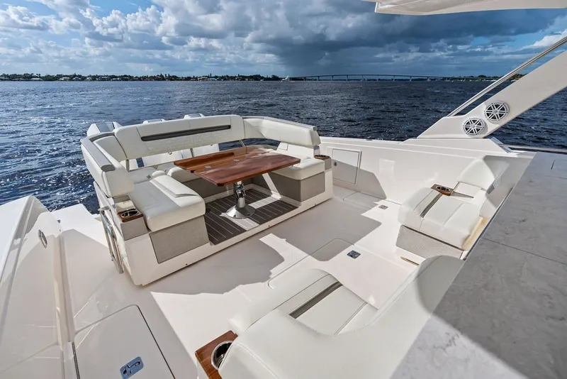 Slide: The Image of Luxurious seating area on 2024 Tiara Yachts 38 LS, overlooking serene waters. - 30