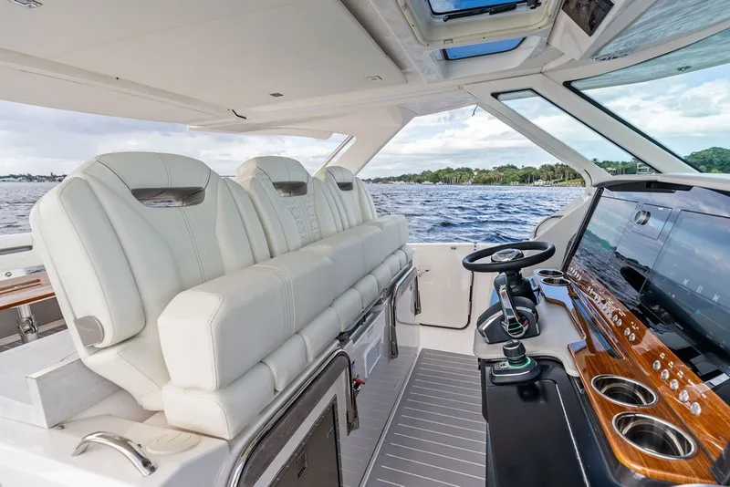 Slide: The Image of Luxurious interior of 2024 Tiara Yachts 38 LS with plush seating and modern helm. - 44