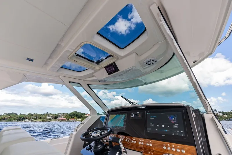 Slide: The Image of 2024 Tiara Yachts 38 LS helm with advanced navigation and entertainment systems. - 45