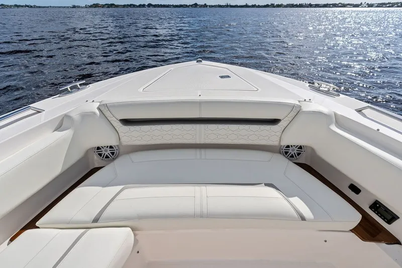 Slide: The Image of Luxurious seating on the 2024 Tiara Yachts 38 LS, overlooking serene waters. - 25