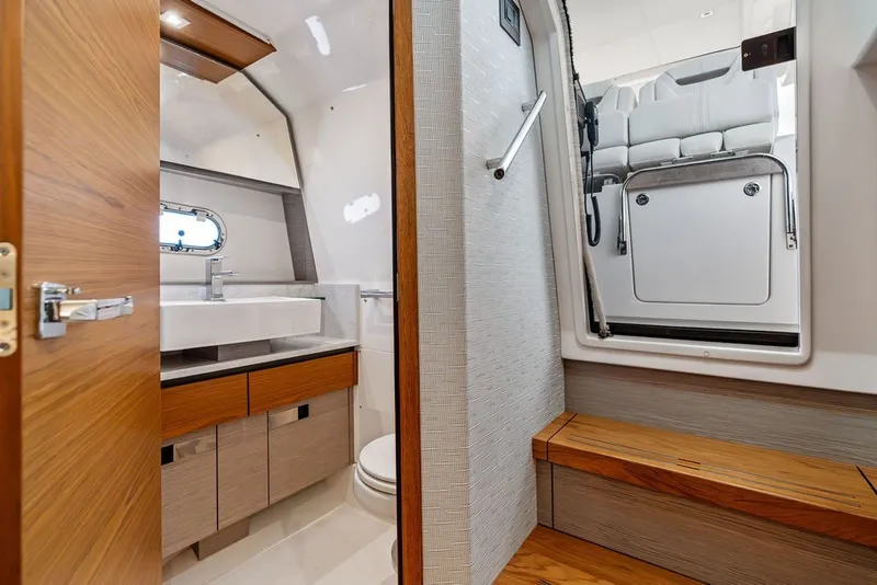 Slide: The Image of Luxurious interior of 2024 Tiara Yachts 38 LS, featuring modern bathroom and seating area. - 54
