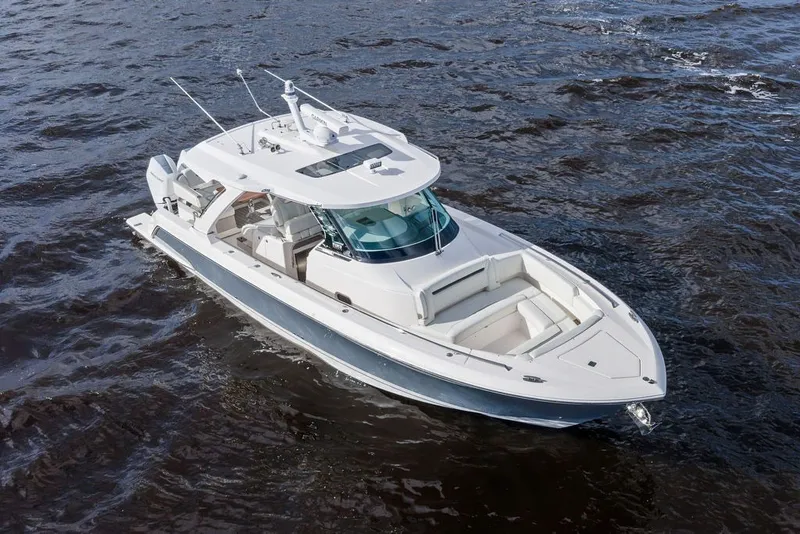 Slide: The Image of 2024 Tiara Yachts 38 LS cruising on open water, showcasing sleek design and luxury features. - 23