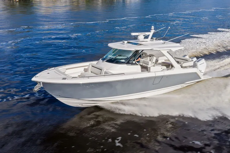 Slide: The Image of 2024 Tiara Yachts 38 LS cruising on open water, showcasing sleek design and performance. - 11