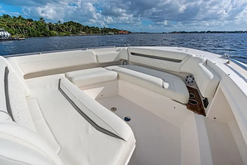 Slide: The Image of 2024 Tiara Yachts 38 LS boat interior with luxurious seating and scenic water view. - 24
