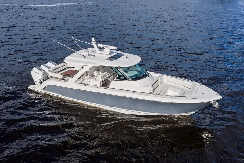 Slide: The Image of 2024 Tiara Yachts 38 LS cruising on open water, showcasing sleek design and luxury features. - 5
