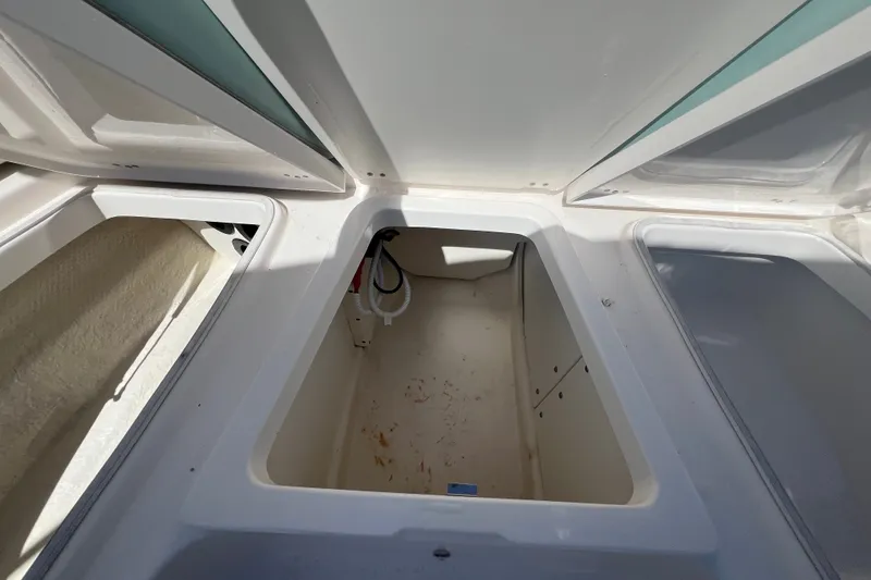 Slide: The Image of Open storage compartment on 2024 Robalo 206 Cayman boat, showcasing interior space. - 20