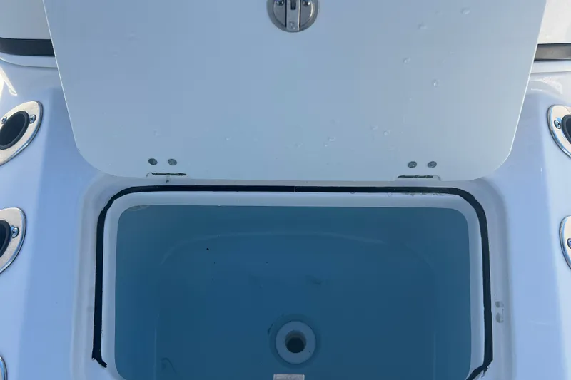 Slide: The Image of Open storage compartment on 2024 Robalo 206 Cayman boat. - 17