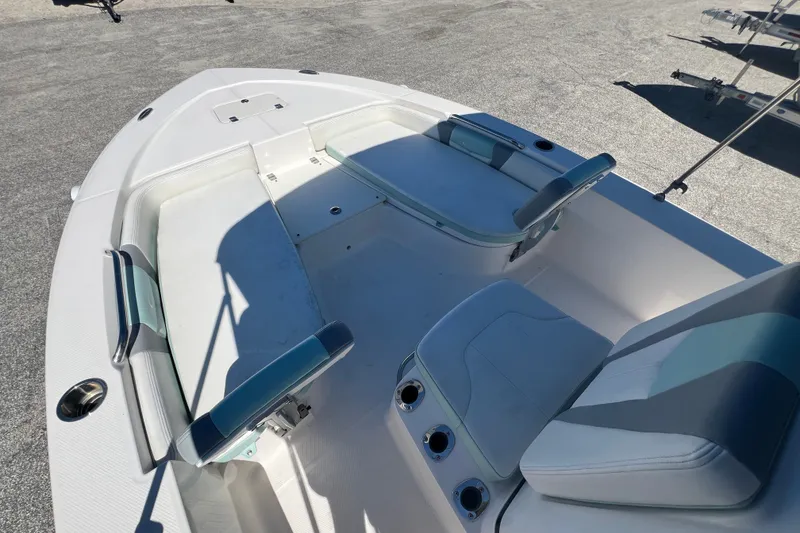 Slide: The Image of 2024 Robalo 206 Cayman boat interior with seating and cup holders. - 15