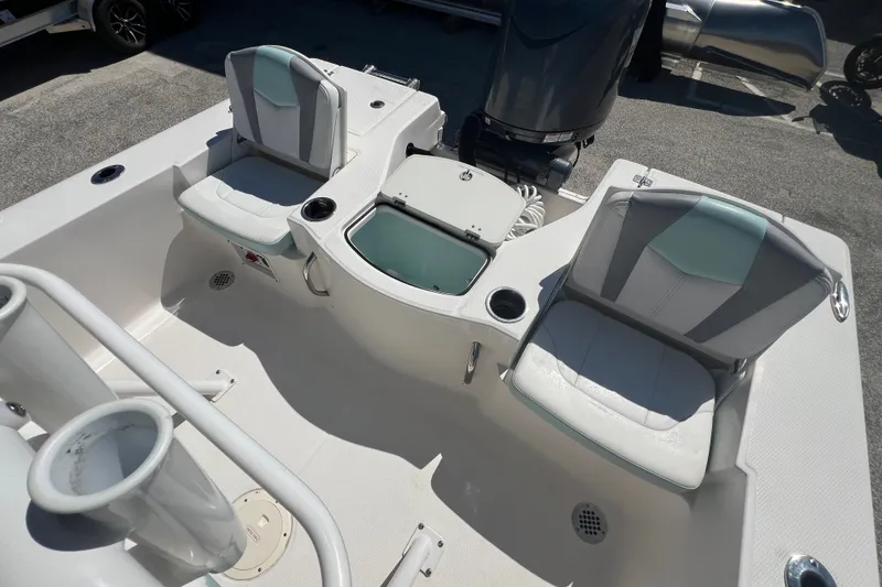 Slide: The Image of 2024 Robalo 206 Cayman boat interior with seating and storage compartments. - 8