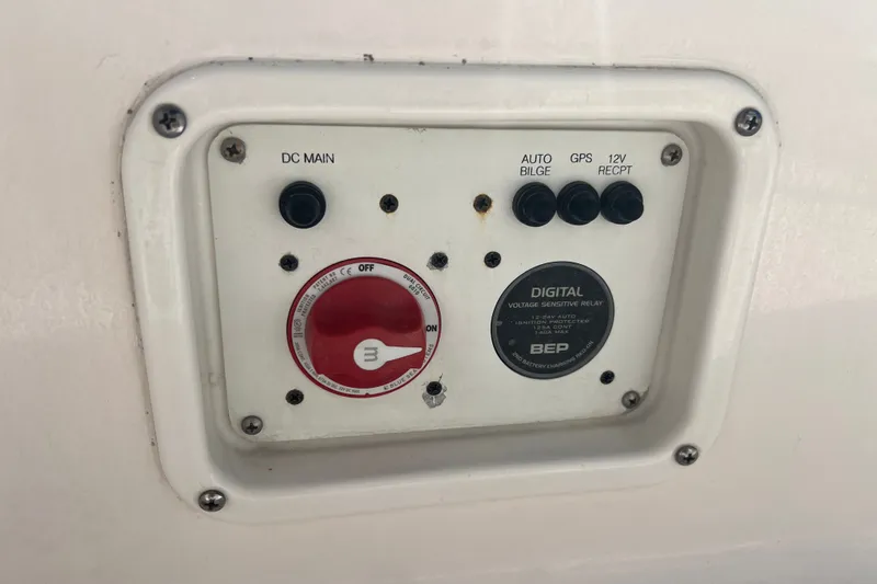 Slide: The Image of Control panel on 2024 Robalo 206 Cayman boat with switches and voltage relay. - 9
