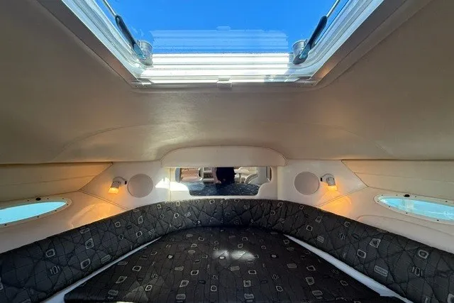 Slide: The Image of Interior cabin of 2000 Sea Ray 340 Sundancer with skylight and cushioned seating. - 41