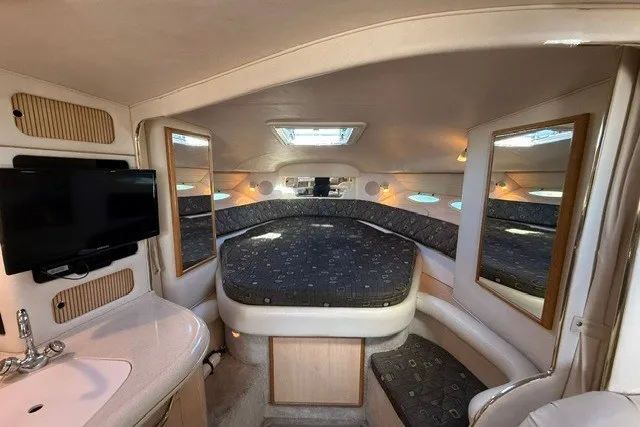 Slide: The Image of Interior of 2000 Sea Ray 340 Sundancer yacht with cozy bed and modern amenities. - 30