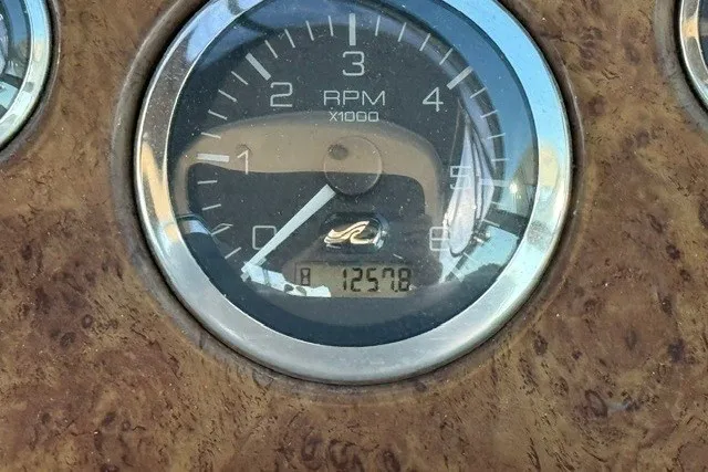 Slide: The Image of Tachometer of 2000 Sea Ray 340 Sundancer showing 1257.8 hours. - 25