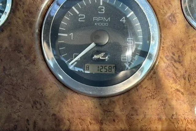 Slide: The Image of Tachometer of 2000 Sea Ray 340 Sundancer showing 1258.7 hours. - 26