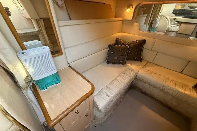 Slide: The Image of Interior of 2000 Sea Ray 340 Sundancer yacht with beige seating and decorative pillows. - 50
