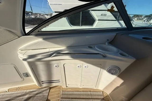 Slide: The Image of Interior view of a 2000 Sea Ray 340 Sundancer boat with a compact kitchenette. - 16