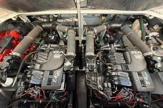 Slide: The Image of Engine compartment of a 2000 Sea Ray 340 Sundancer with twin 7.4L MPI V8 engines. - 54