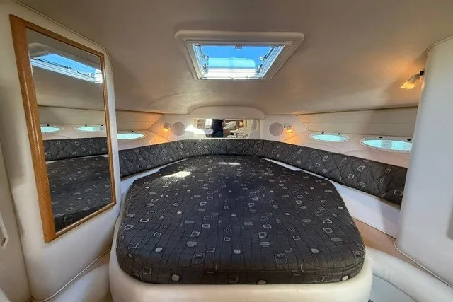 Slide: The Image of Interior cabin of 2000 Sea Ray 340 Sundancer with skylight and patterned bedding. - 37