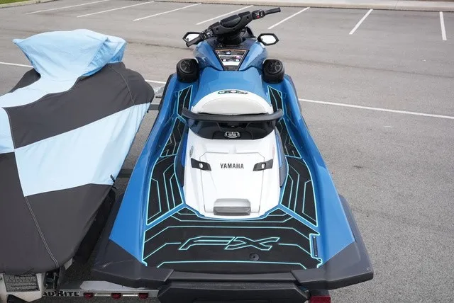 Slide: The Image of A 2024 Yamaha WaveRunner FX Cruiser HO in a parking lot, featuring a sleek blue design. - 6