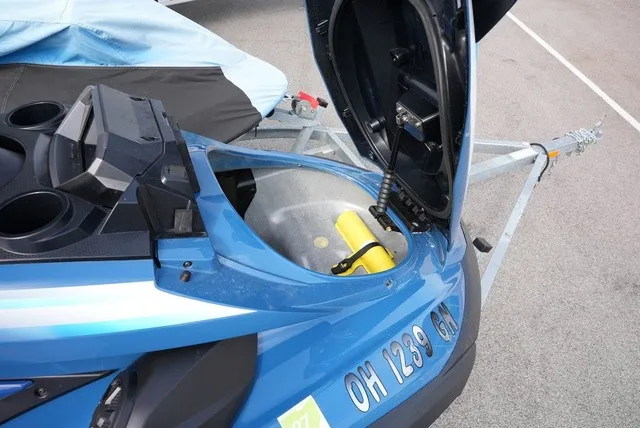 Slide: The Image of A blue 2024 Yamaha WaveRunner FX Cruiser HO on a trailer with an open storage compartment. - 11