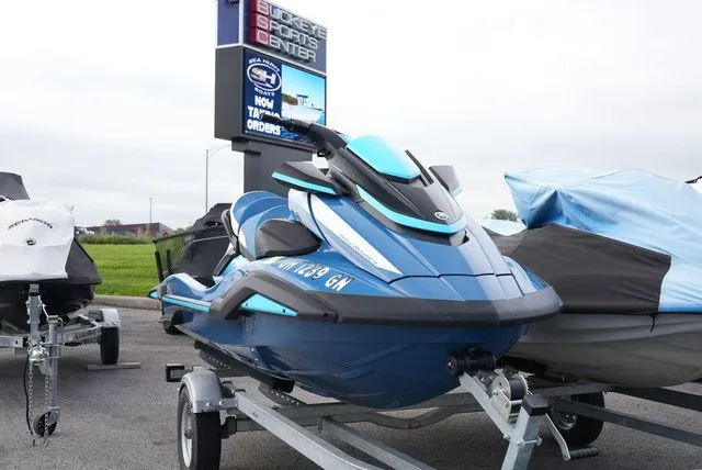 Slide: The Image of A blue 2024 Yamaha WaveRunner FX Cruiser HO sits on a trailer outdoors. - 2
