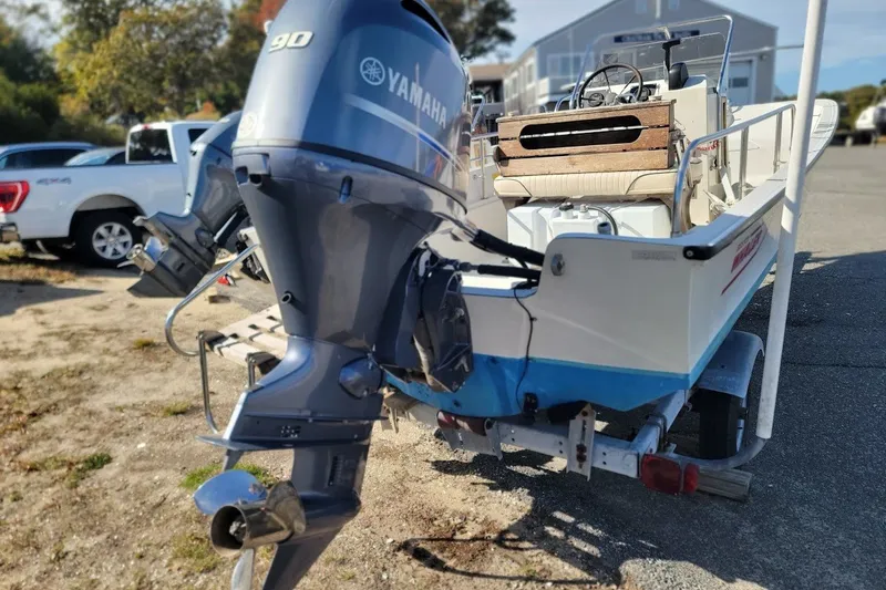 Slide: The Image of 1986 Boston Whaler 17 Montauk with Yamaha 90 outboard motor on trailer. - 15