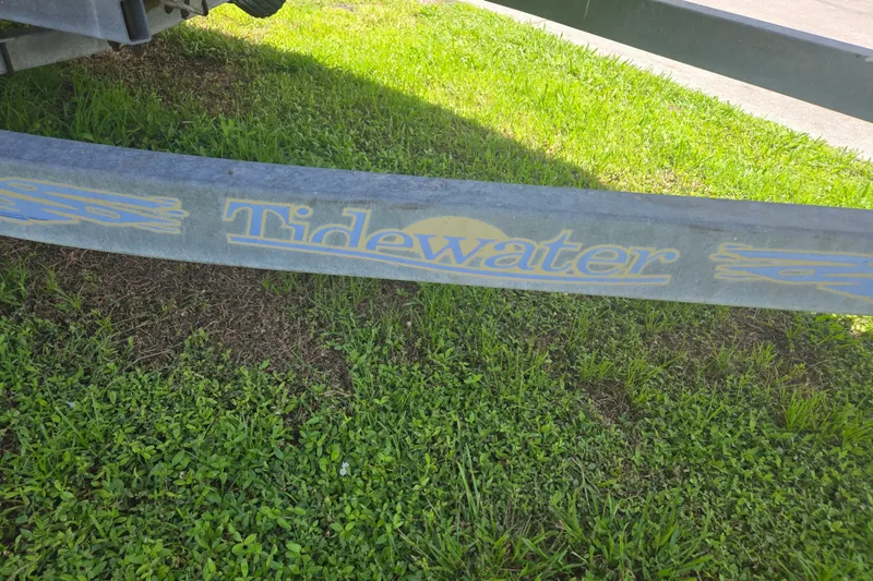 Slide: The Image of Trailer with "Tidewater" logo on grass, for 2005 Trophy 2352 Walkaround boat. - 56
