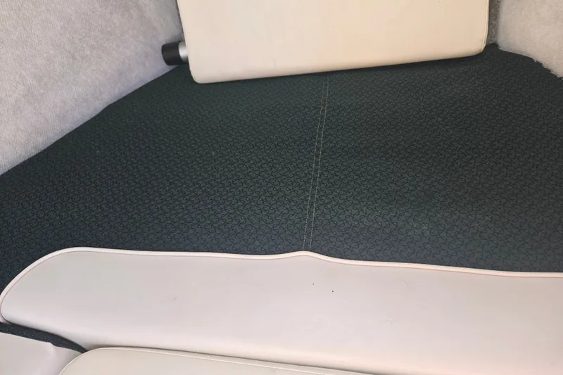 Slide: The Image of Interior seating of a 2005 Trophy 2352 Walkaround boat, featuring patterned upholstery. - 45