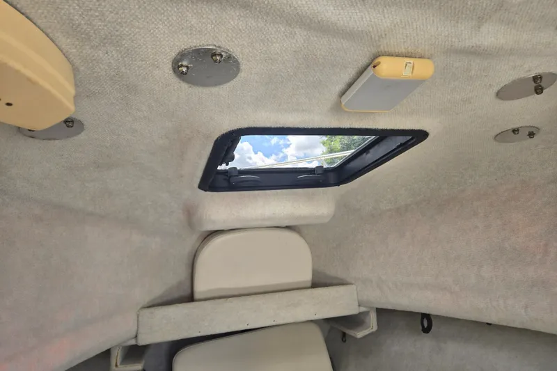 Slide: The Image of Interior cabin view of a 2005 Trophy 2352 Walkaround boat with a skylight. - 44