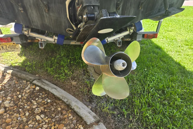 Slide: The Image of Propeller of a 2005 Trophy 2352 Walkaround boat on a trailer. - 49