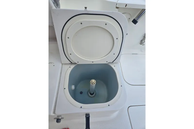Slide: The Image of Livewell compartment on a 2005 Trophy 2352 Walkaround boat, open lid view. - 25