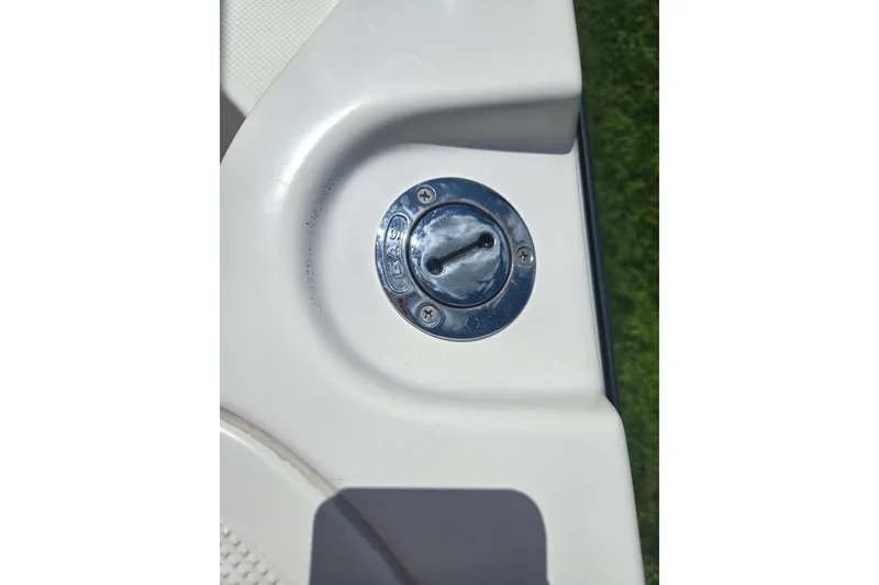 Slide: The Image of Fuel cap on a 2005 Trophy 2352 Walkaround boat, close-up view. - 23