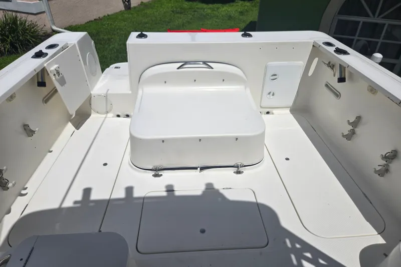 Slide: The Image of 2005 Trophy 2352 Walkaround boat interior with seating and storage compartments. - 33