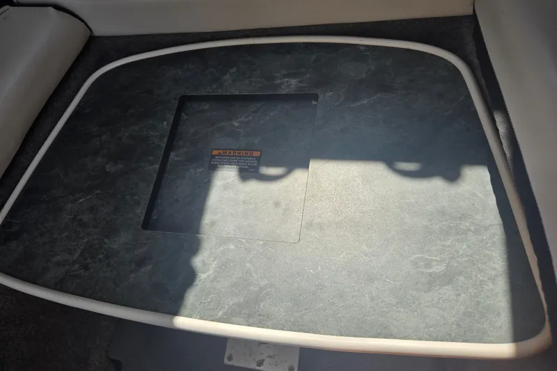 Slide: The Image of Floor panel of a 2005 Trophy 2352 Walkaround boat with warning label. - 41