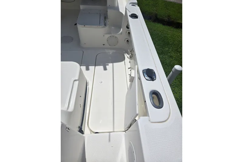 Slide: The Image of 2005 Trophy 2352 Walkaround boat interior with seating and storage compartments. - 32