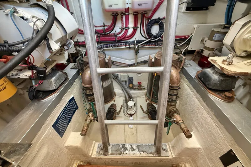 Slide: The Image of Engine room of 1999 Grand Banks 38 Eastbay EX with visible machinery and wiring. - 40