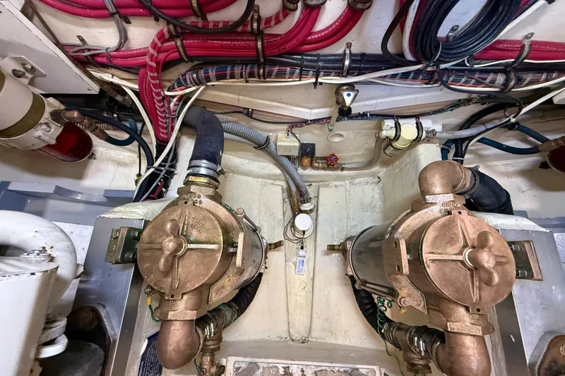 Slide: The Image of Engine room of 1999 Grand Banks 38 Eastbay EX with visible wiring and machinery. - 43
