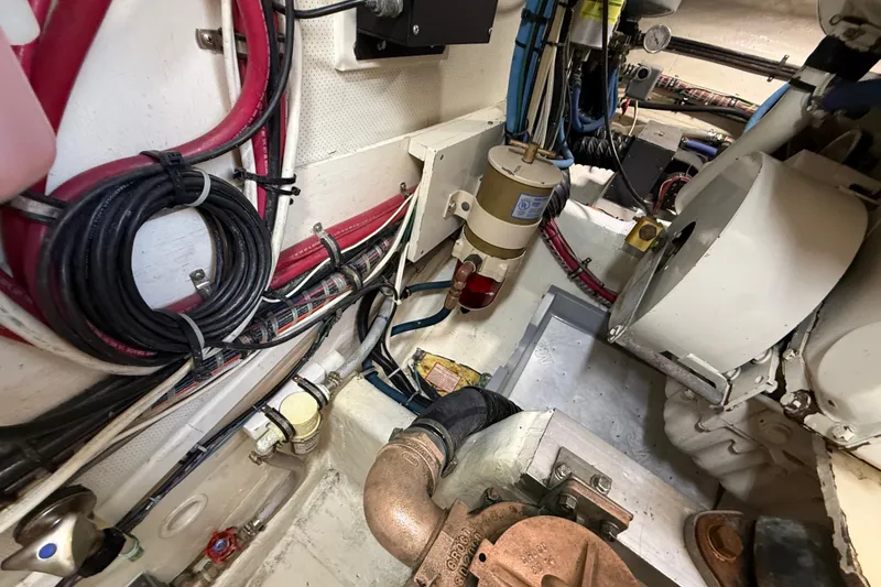 Slide: The Image of Engine room of 1999 Grand Banks 38 Eastbay EX with wiring and mechanical components. - 45