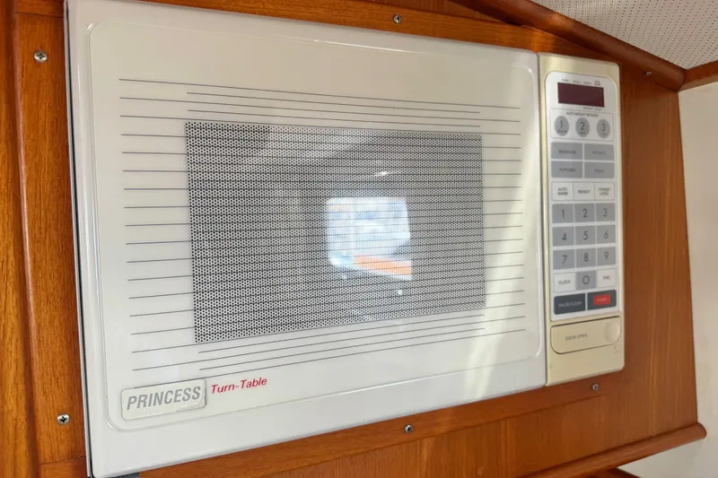 Slide: The Image of Built-in microwave on 1999 Grand Banks 38 Eastbay EX yacht, featuring a Princess turn-table. - 27