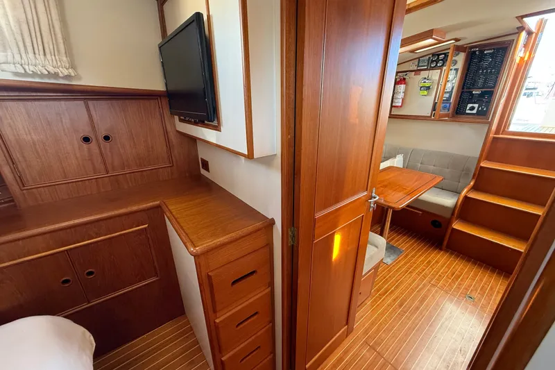 Slide: The Image of Interior of 1999 Grand Banks 38 Eastbay EX with wood finish and seating area. - 35