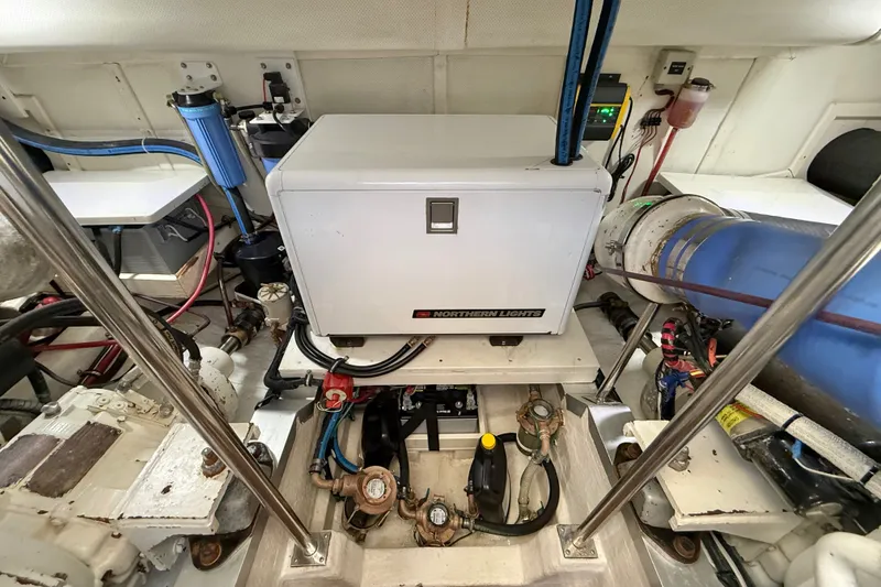 Slide: The Image of Engine room of 1999 Grand Banks 38 Eastbay EX with Northern Lights generator. - 46