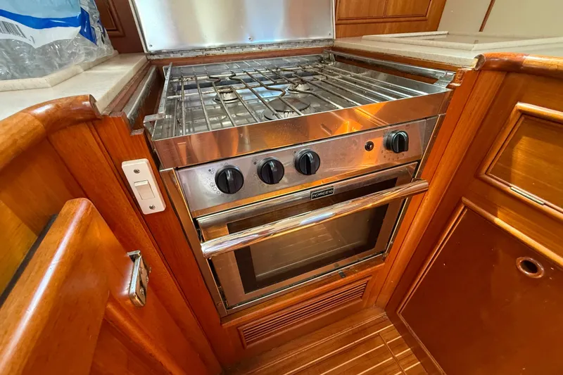 Slide: The Image of Stainless steel stove and oven in 1999 Grand Banks 38 Eastbay EX yacht kitchen. - 25
