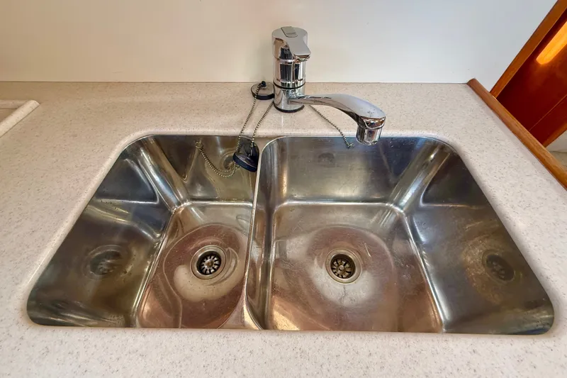 Slide: The Image of Stainless steel double sink with modern faucet on Grand Banks 38 Eastbay EX, 1999 model. - 28