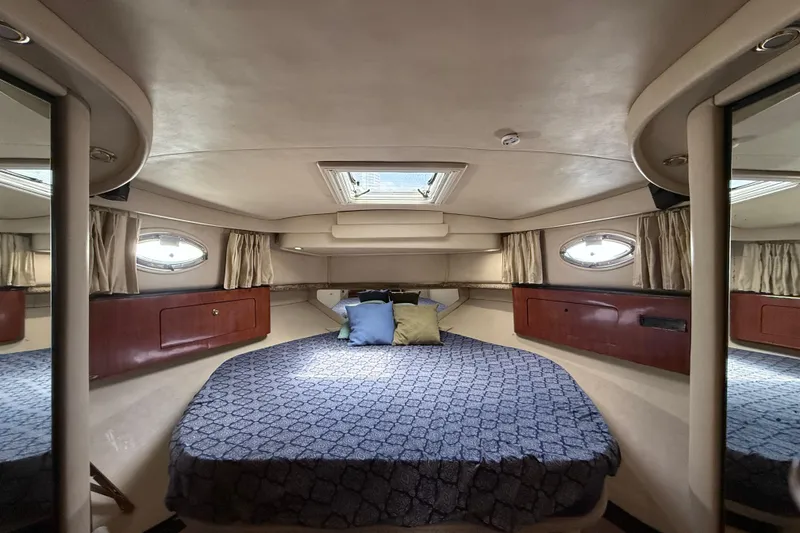 Slide: The Image of Luxurious cabin interior of 2001 Sea Ray 450 Express Bridge yacht with cozy bedding. - 19